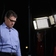 Former Texas Gov. Rick Perry enjoys a quiet moment on the campaign trail before becoming the first candidate to drop out of the Republican primary race. Image via Getty.